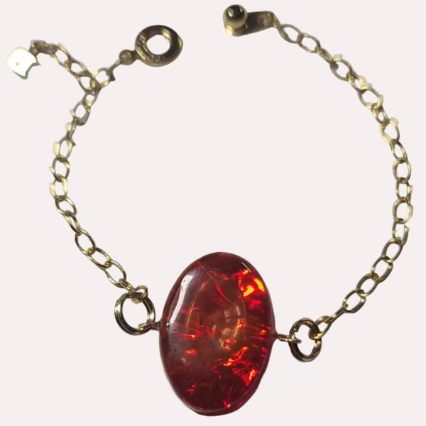 24k gold plated bracelet with red, yellow and orange inlay domed with clear resin.