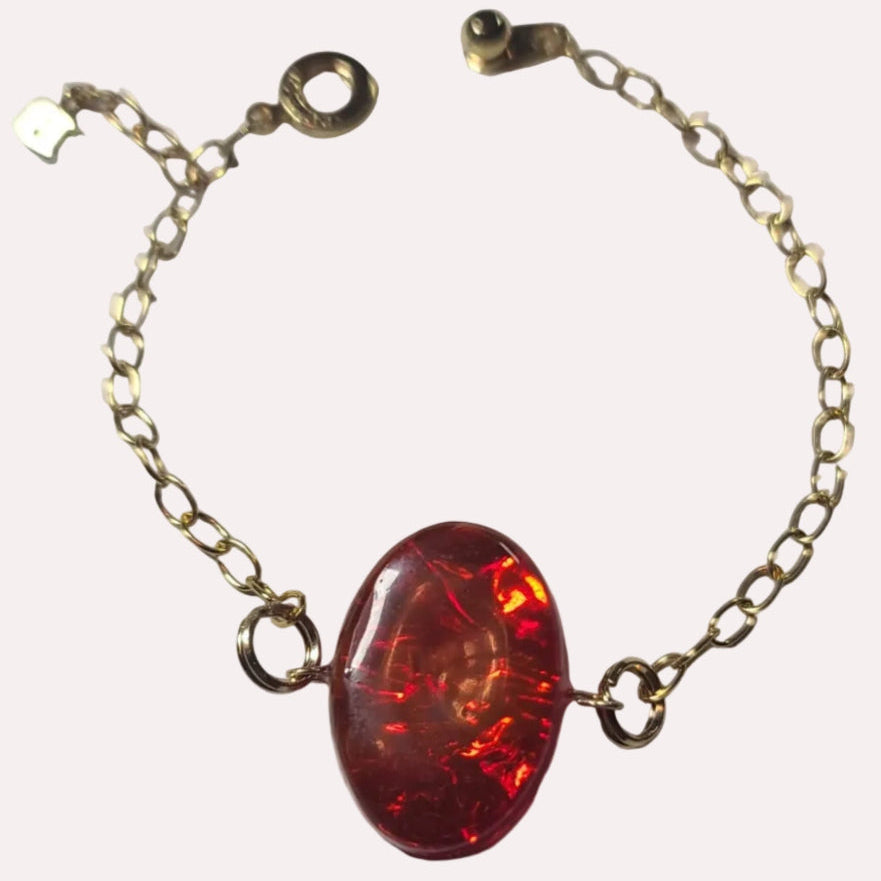 24k gold plated bracelet with red, yellow and orange inlay domed with clear resin.